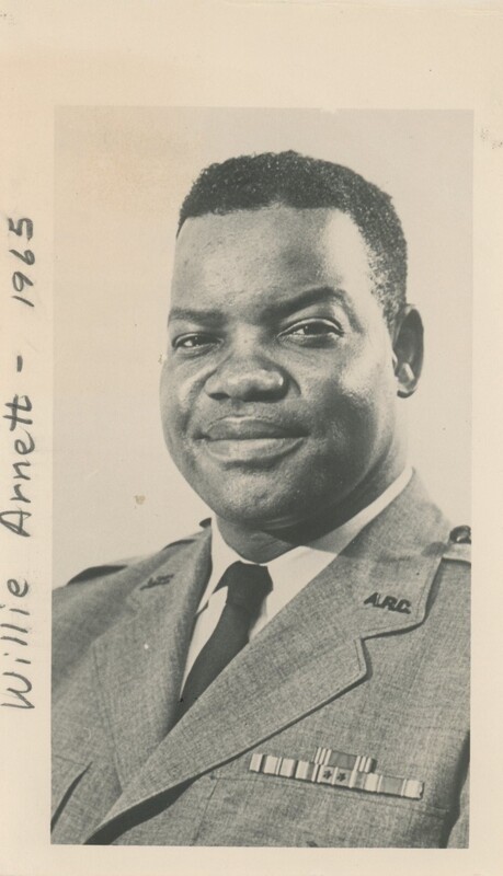A person wearing a military uniform taking a headshot portrait.