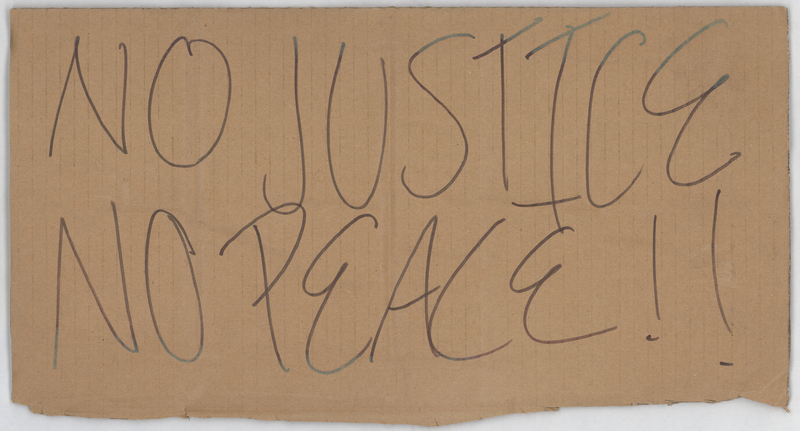 Brown corrugated cardboard sign. "NO JUSTICE, NO PEACE!!" handwritten in black ink at anterior.


Used by an unknown protestor in the George Floyd protest march of the night of 6/2-6/3/2020. The March began at the Black Hawk Co. Jail and was ultimately broken up by the Waterloo Police Department in Washington Park and on the 218 overpass. Grout Museum District staff collected the sign from the parking lot of the Snowden House on 6/4/2020.