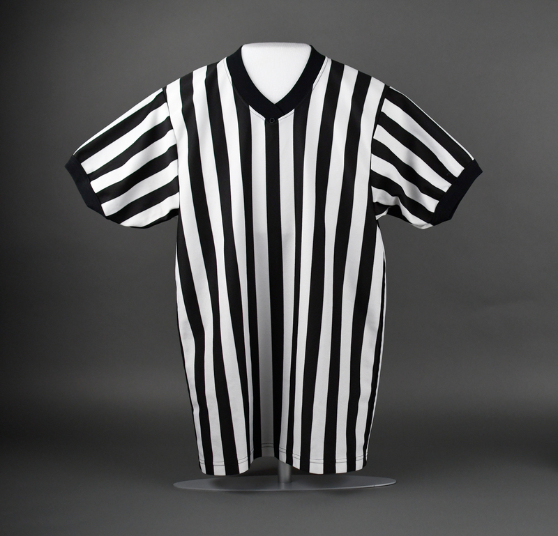 V-necked short-sleeve referee’s jersey in black and white striped polyester.  Machine-stitched.   
  
Greg Kent “Streetz” Walker, Jr. of Waterloo was a basketball referee for the Iowa Referee Association and respected for his work in local youth outreach.  He was tragically murdered on May 19, 2018.  His murder remains unsolved.
If you have information regarding the murder of Greg Walker, call the Waterloo Police Department at (319) 291-4383.