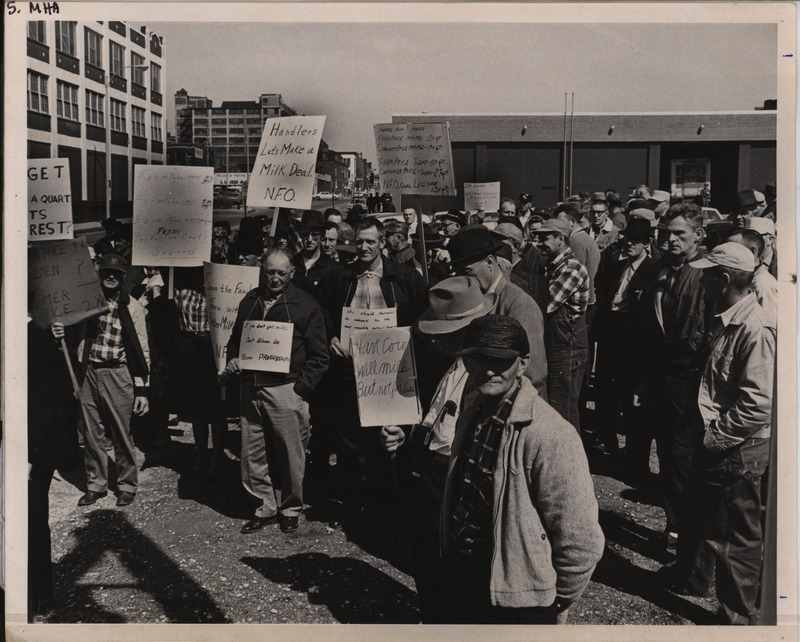 Photograph of NFO President, Oren Lee Staley, answering questions after the first milk pour out in the streets of Corning, Iowa.