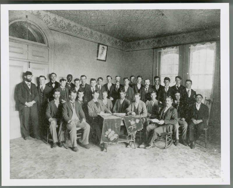 Photograph of the Welch Eclectic Society (Literary Arts Group, 1896), Iowa State College. George W. Carver is in the back row.