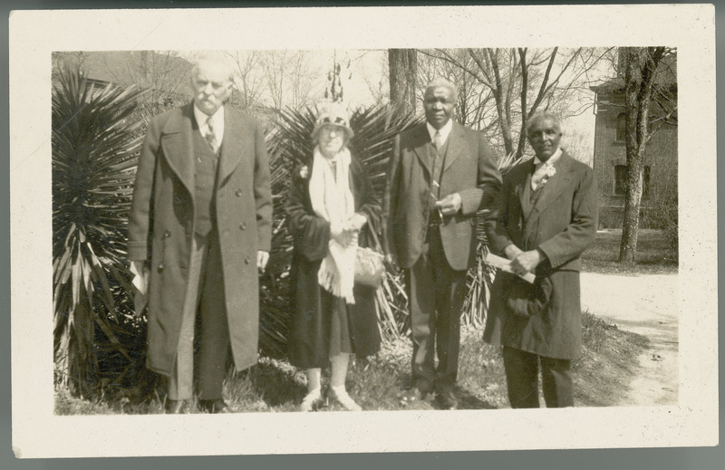 Louis H. Pammel, Mrs. Pammel, George W. Carver, and Tuskegee Institute President Robert R. Moton (left to right) . Yucca in the background. Neg. No. 0062564 (4x5) 1928.