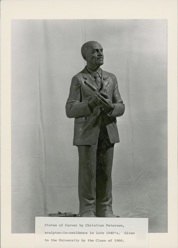 Statue of George Washington Carver by Christian Petersen, sculptor-in-residence in the late 1940s. Originally a plaster sculpture, it was given to the University and placed in Carver Hall at the dedication of the hall in 1970 by the Class of 1968. Christian Petersen came over and stood by August Bang's side. "When I look upon Carver as you have him here," Bang said, "the words which were written at his death come to my mind--'He wandered with God'." "That is just what I have tried to say," answered the artist, and a beautiful smile lighted his face. In 1998, with gift funds, the statue was cast in bronze as it was originally meant to be, and installed in the courtyard between Carver and Beardshear Halls.