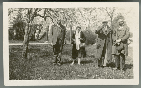 Tuskegee Institute President Robert R. Moton, Mrs. Pammel, Louis H. Pammel, and George W. Carver (left to right). Photo x Williamson 3-1928. Yucca in background.