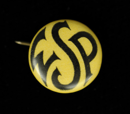 Round yellow button with "WSP" in black lettering on the front.