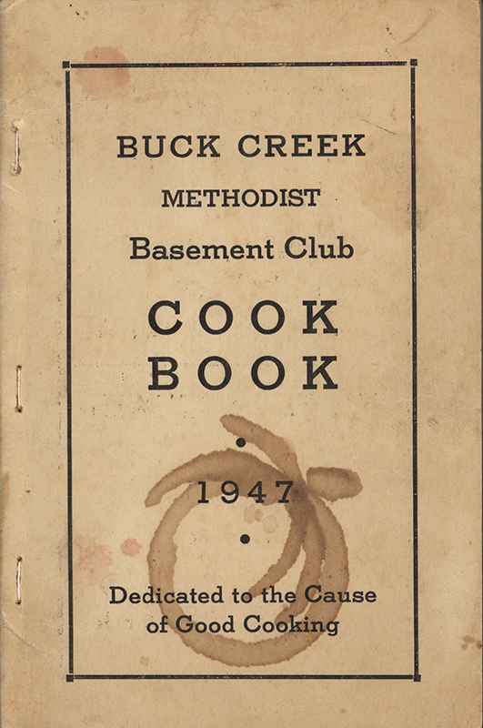 A community cookbook by the Buck Creek Methodist Basement Club in Hopkinton, Iowa. It contains recipes from local contributors, along with advertisements from area businesses.