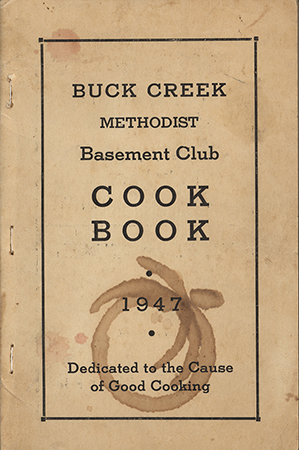 A community cookbook by the Buck Creek Methodist Basement Club in Hopkinton, Iowa. It contains recipes from local contributors, along with advertisements from area businesses.