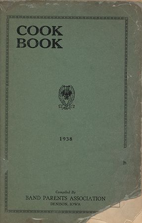 This cookbook compiled by the Denison Band Parents Association includes advertisements, household tips, and an additional handwritten recipe at the end.
