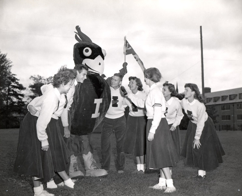 Cy the Cardinal with cheerleaders