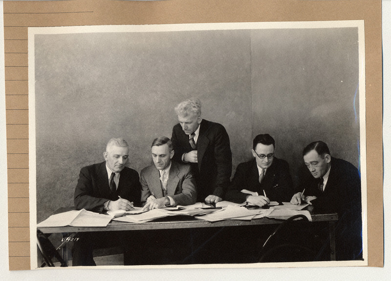 Photograph of a group of men at a Corn and Hog Conference in 1934.
