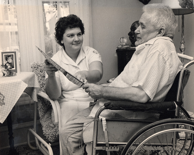 Photograph of a nurse with a patient in 1966.