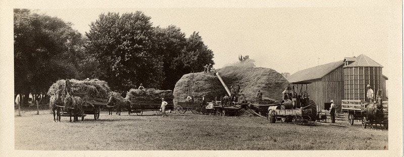 Photograph of farmers out threshing in 1919.