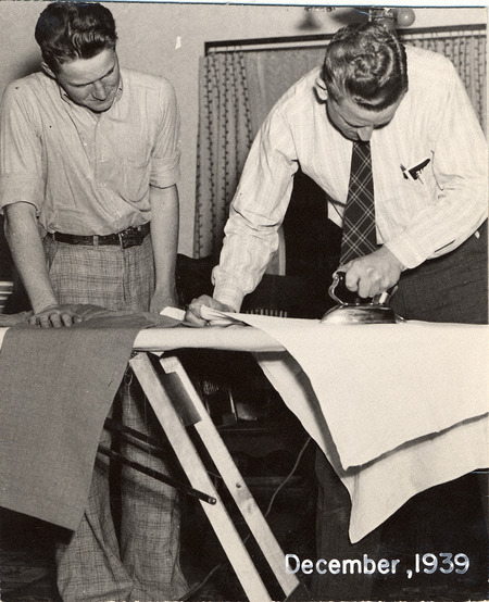 Two men ironing.