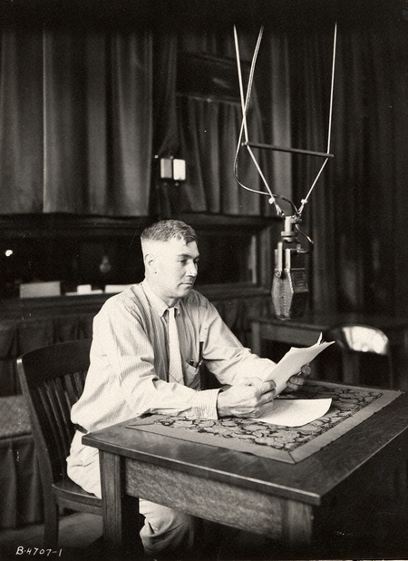 Photograph of a man giving a broadcast in 1937.