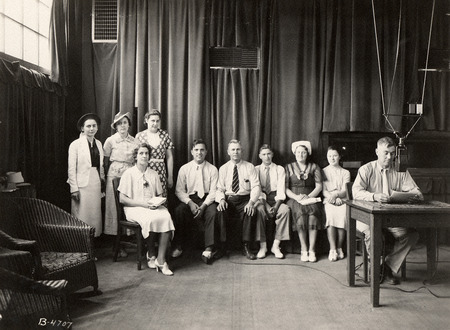 Group photograph of people during a broadcast.