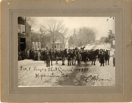Photograph with a caption that reads: "Sec 1. Lenox Short Course, Hopkinton, Iowa. 1910." A group of men are meeting for the short course.