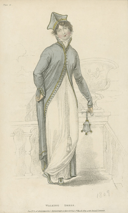 Walking Dress, consisting of high collared, straight to the body dress with a tasseled belt, and an overcoat and hat.
