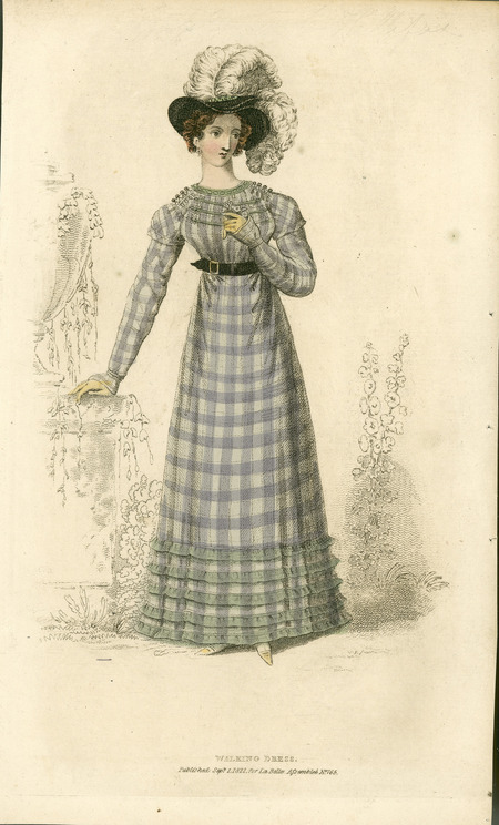 Walking Dress, illustrating the use of plaid in cotton/silk fabrics, a higher neckline, shirred bodice, the dropping waist emphasized by a belt, and the emphasis of decoration on the lower hem (published for La Belle Assemblee).