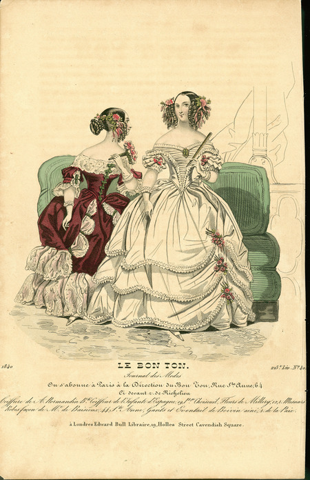 Two evening dresses with shoulder baring, wide necklines (for evening only), fitted bodices, yoked waistlines, short sleeves, gloves, full skirts and elaborate coiffures with ringlets, ribbons, and flowers. Left dress has a polonaise style skirt and right dress has a ruched bodice front and a 3 layer skirt. (published for Le Bon Ton by Edward Bull Library, London).