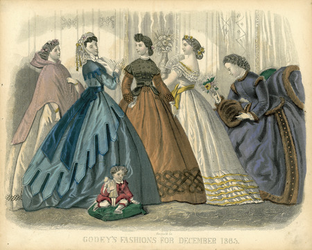 Day and evening dresses all with full, hoop skirts. The first woman is wearing a burnoose over her dress. The second has a dagged, shoulder cape over her long sleeved, fitted bodice; a long sash tied around her waist with a bow in back; a layered skirt with a dagged, tassel trimmed top layer; and a lace cap. The center woman has a layered bodice with a jewel neckline, cap oversleeves with tassels; long, ruffle cuffed sleeves; and a belted waist with basques. The third woman has an evening dress with a wide, low neckline trimmed with ruffles, short sleeves, a ribbon sash tied around her waist, and ruffles around the bottom of her skirt. The fifth woman has a fur trimmed dress with a fitted basque bodice, jewel neckline, long sleeves, center front buttons, a fur muff and matching cloak or mantle. The child is weaning an outfit with a small collar, long sleeves, belted waist, and a skirt. (published for Godey's Fashions by Kimmel & Co.).