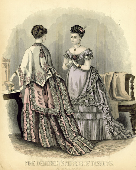 Two evening dresses with bustles, multiple overskirts with ruffles and lace trim, wrist length gloves, hair completely up with small feather in one's hair, necklace and bracelets, one has wide rounded neckline with short puff sleeves and pointed waistline, other has dolman with embroidered trim and tassels. (published by Mme. Demorest's Mirror of Fashions).