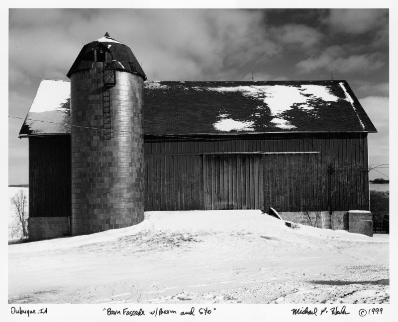 Photograph of a barn taken in Dubuque, Iowa, entitled "Barn Facade with Berm and Silo."