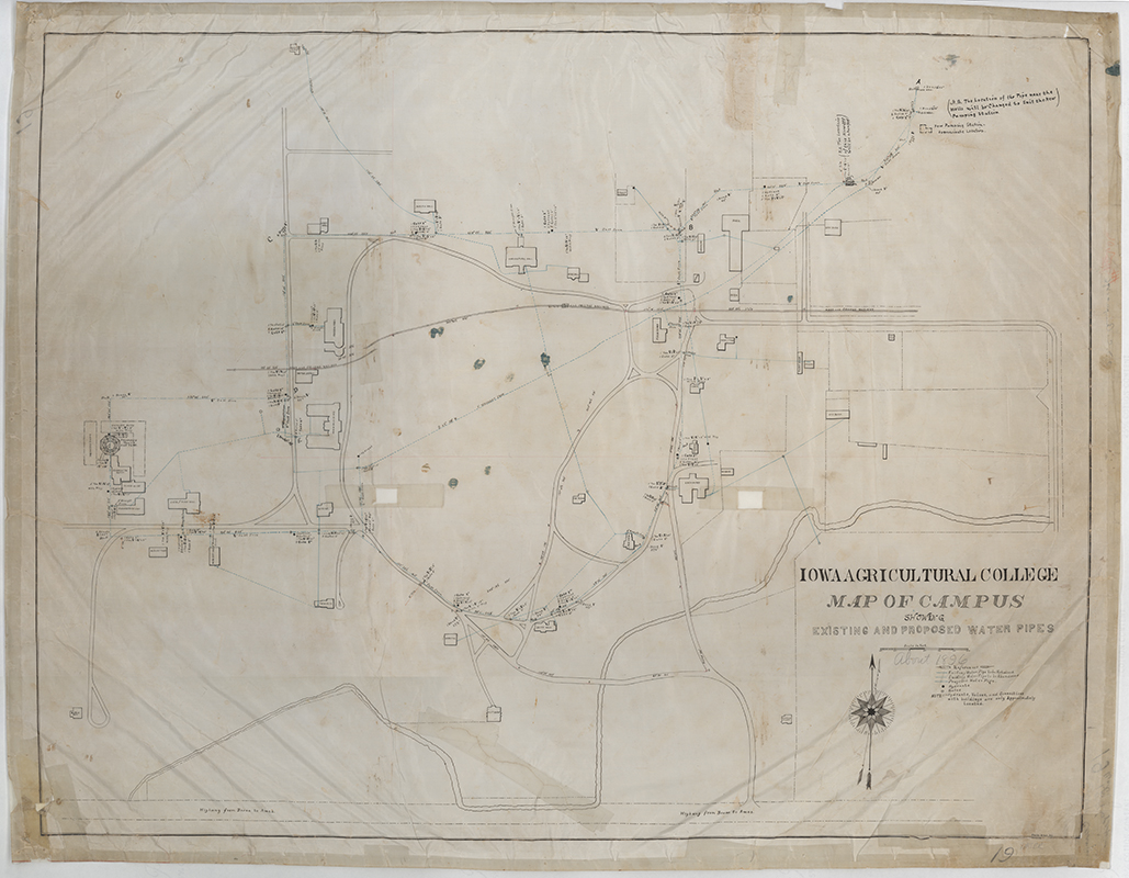 Map of the campus of Iowa Agricultural College showing the locations of existing and proposed water pipes.