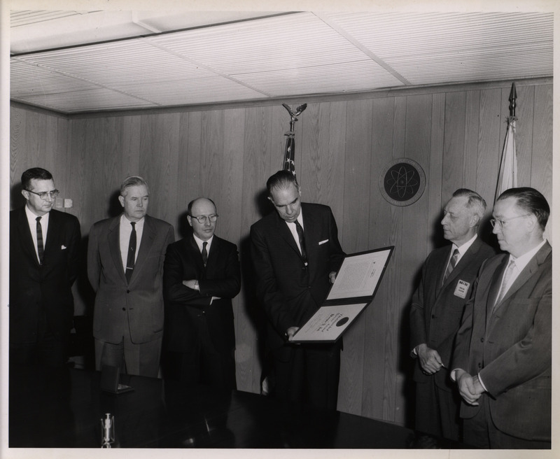 Photograph of Dwight Ink and others during Ink's Distinguished Service Award ceremony