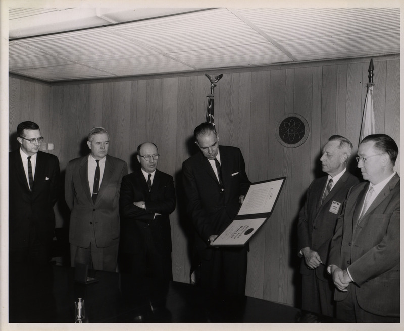 Photograph of Dwight Ink and others during Ink's Distinguished Service Award ceremony