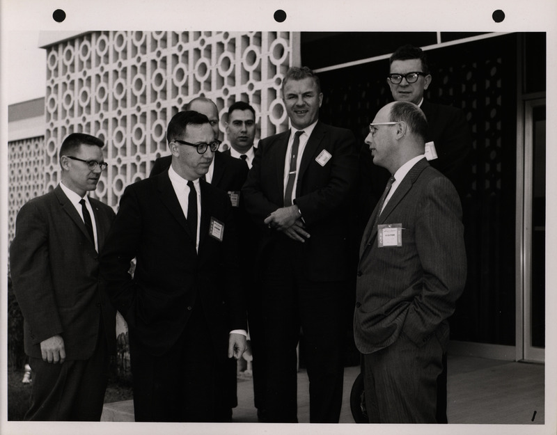 Photograph of Dwight Ink with others during the National Aeronautics and Space Administration and Atomic Energy Commission rocket plant visit