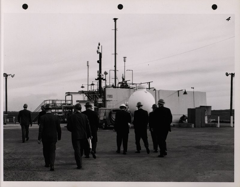 Photograph of Dwight Ink with others during the National Aeronautics and Space Administration and Atomic Energy Commission rocket plant visit
