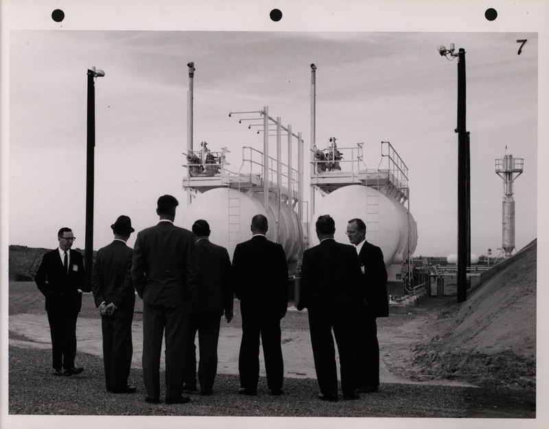 Photograph of Dwight Ink with others during the National Aeronautics and Space Administration and Atomic Energy Commission rocket plant visit