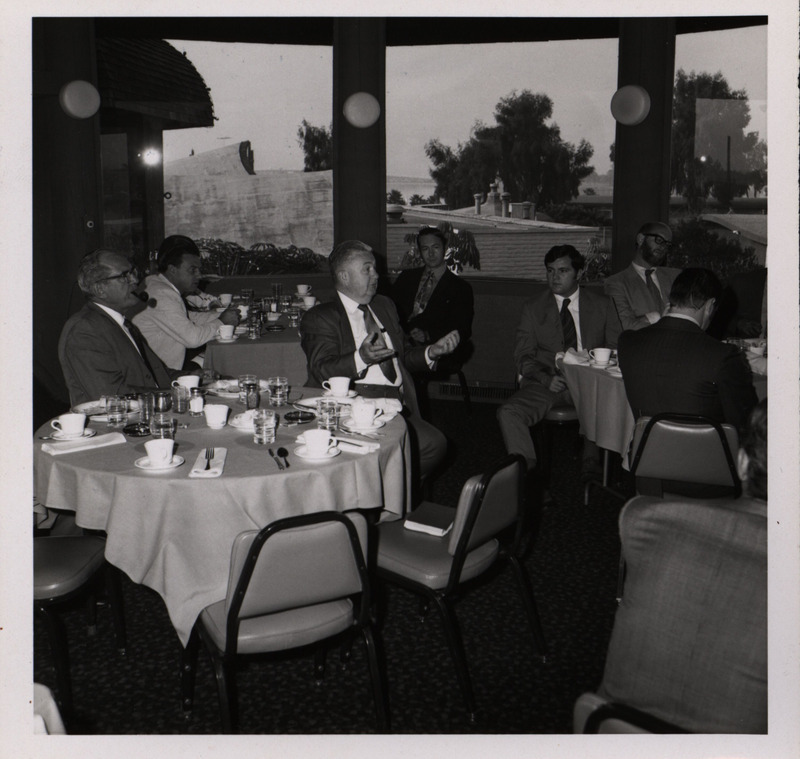 Photograph of people sitting around tables during the "Honoring Glenn V. Gibson" event