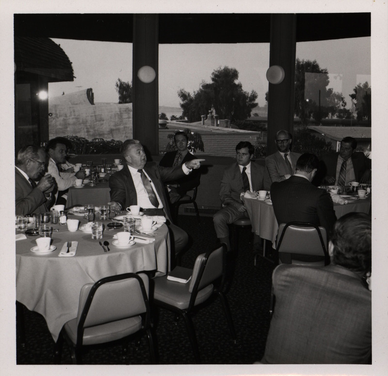 Photograph of people sitting around tables during the "Honoring Glenn V. Gibson" event