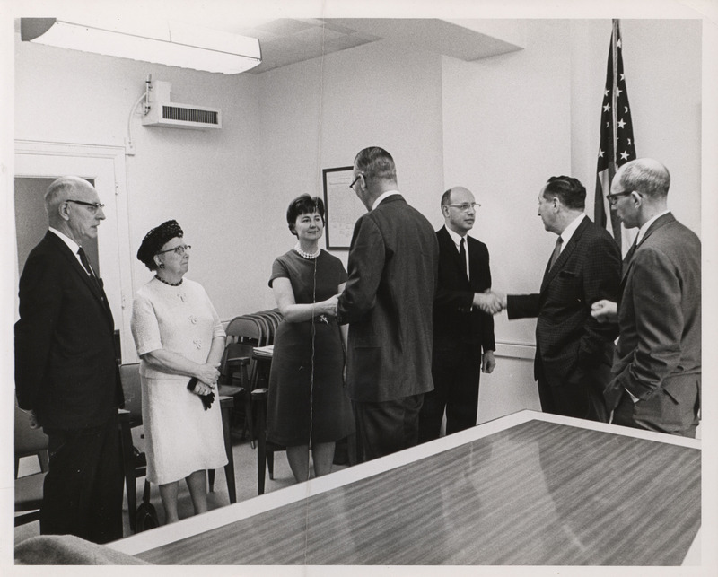 Photograph of Dwight Ink with others during the HUD swearing-in ceremony