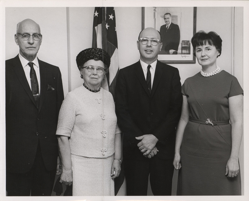 Photograph of Dwight Ink with others during the HUD swearing-in ceremony