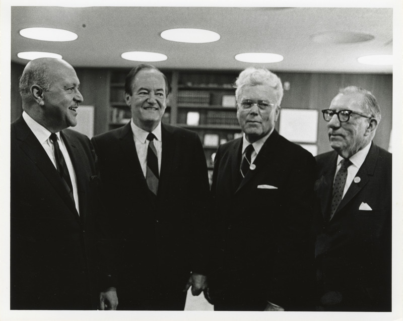 Photograph of Robert Weaver, Hubert Humphrey, and other men