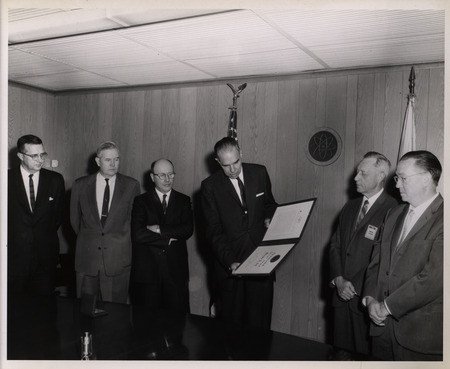 Photograph of Dwight Ink and others during Ink's Distinguished Service Award ceremony
