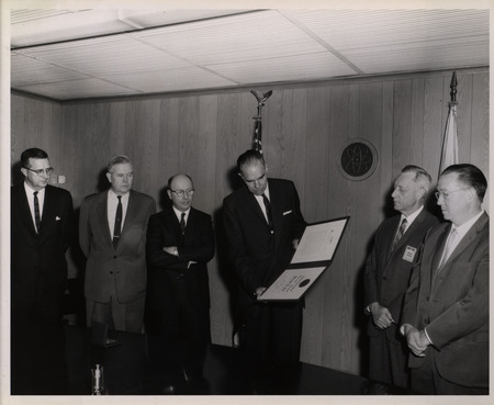 Photograph of Dwight Ink and others during Ink's Distinguished Service Award ceremony