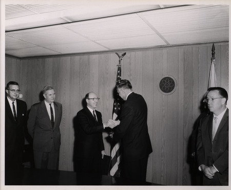 Photograph of Dwight Ink and others during Ink's Distinguished Service Award ceremony