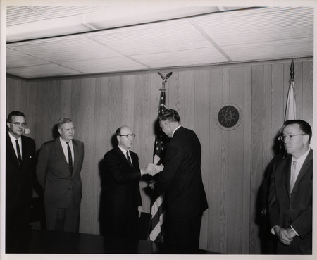 Photograph of Dwight Ink and others during Ink's Distinguished Service Award ceremony