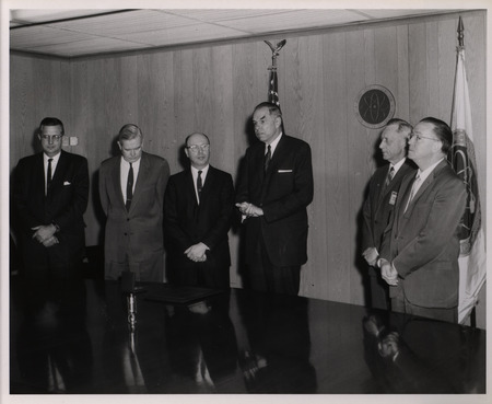 Photograph of Dwight Ink and others during Ink's Distinguished Service Award ceremony
