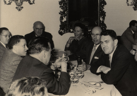 Photograph of people sitting around a table