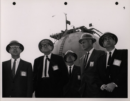 Photograph of Dwight Ink with others during the National Aeronautics and Space Administration and Atomic Energy Commission rocket plant visit