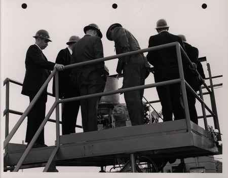 Photograph of Dwight Ink with others during the National Aeronautics and Space Administration and Atomic Energy Commission rocket plant visit