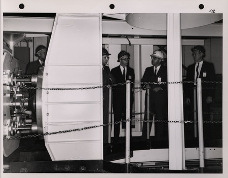 Photograph of Dwight Ink with others during the National Aeronautics and Space Administration and Atomic Energy Commission rocket plant visit