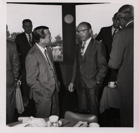 Photograph of Dwight Ink with a group of people during the "Honoring Glenn V. Gibson" event