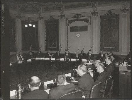 Photograph of group of people sitting around tables at the Indian Treaty Room