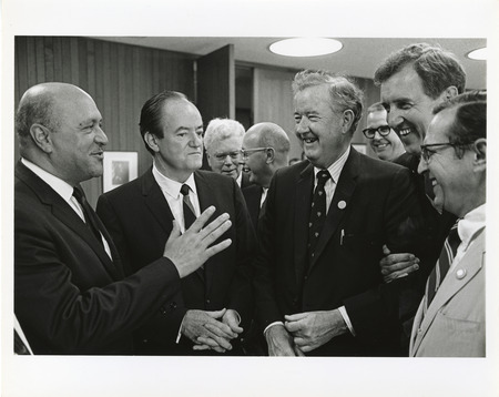 Photograph of Robert Weaver, Hubert Humphrey, Dwight Ink, and other men