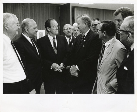 Photograph of Robert Weaver, Hubert Humphrey, Dwight Ink, and other men